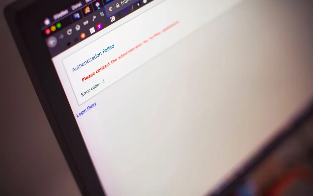 Person looking at a laptop screen showing a blank placeholder web page