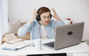 Laptop on a desk showing a website error page in a web browser